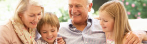 Older couple with their grandchildren