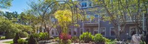 Well-manicured courtyard outside a Welch Senior Living Community