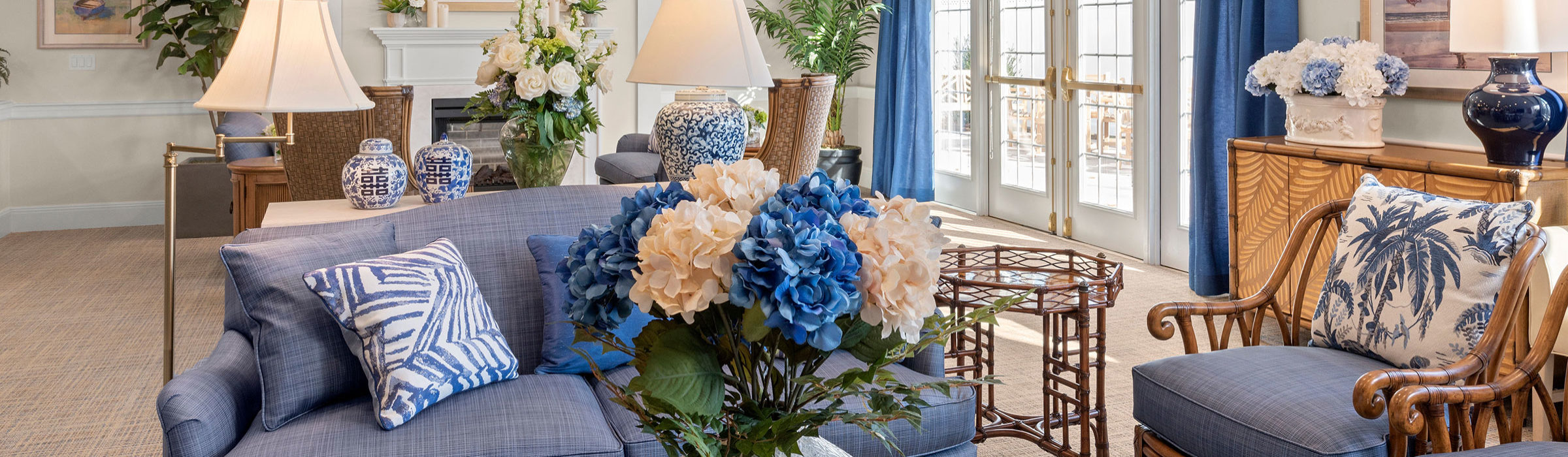 Comfortable living room with lots of floral arrangements