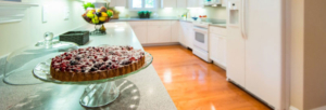 Cake plate with dessert on the kitchen counter in a Garden Home