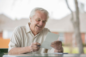 Older man reading a letter
